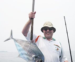 Andy Mennuir with his catch of the day.